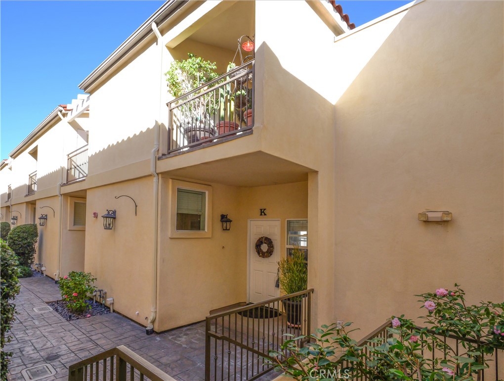 1323 Post Avenue, Unit K Torrance, CA 90501 - Photo 2 of 23 a front view of a house with a yard