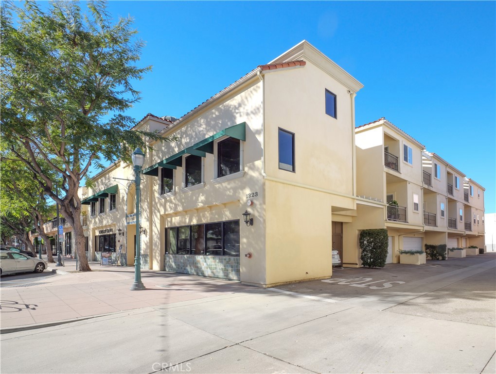 1323 Post Avenue, Unit K Torrance, CA 90501 - Photo 21 of 23 a view of a white building among the street