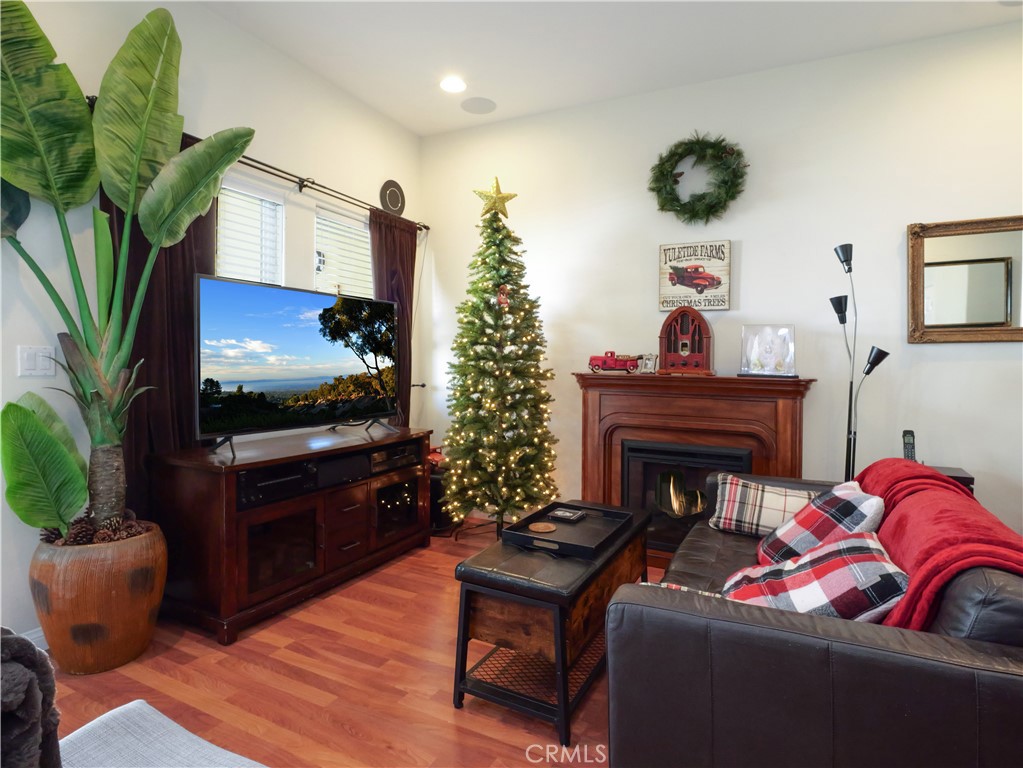 1323 Post Avenue, Unit K Torrance, CA 90501 - Photo 4 of 23 a living room with furniture a flat screen tv and a fireplace