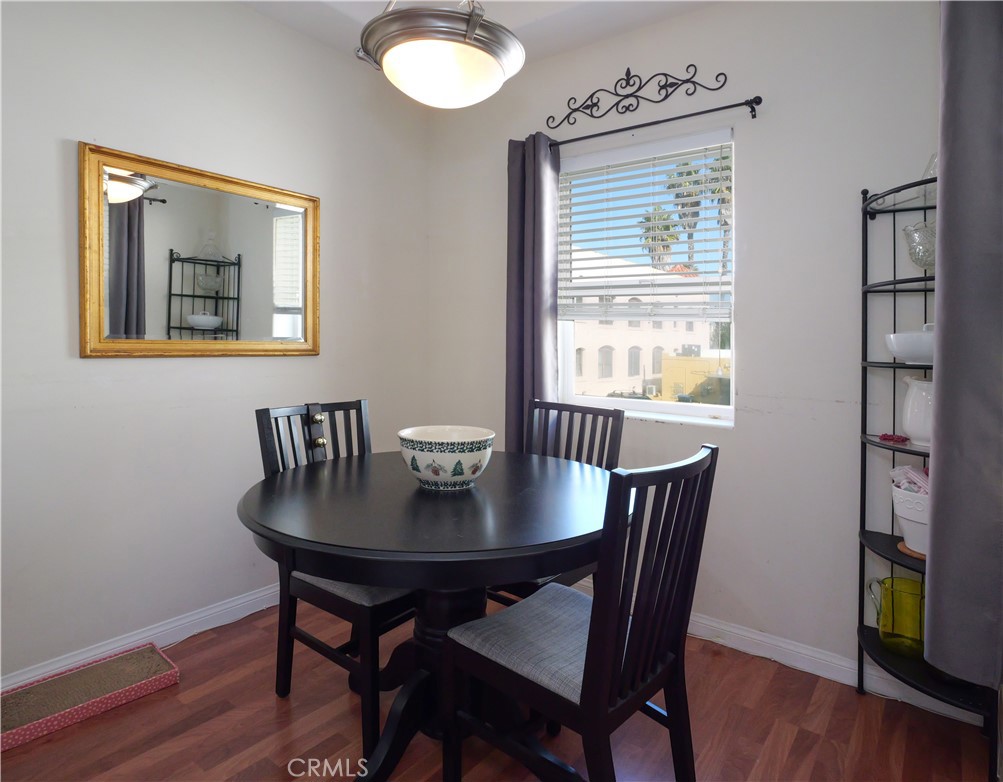 1323 Post Avenue, Unit K Torrance, CA 90501 - Photo 7 of 23 a view of a dining room with furniture wooden floor and a window