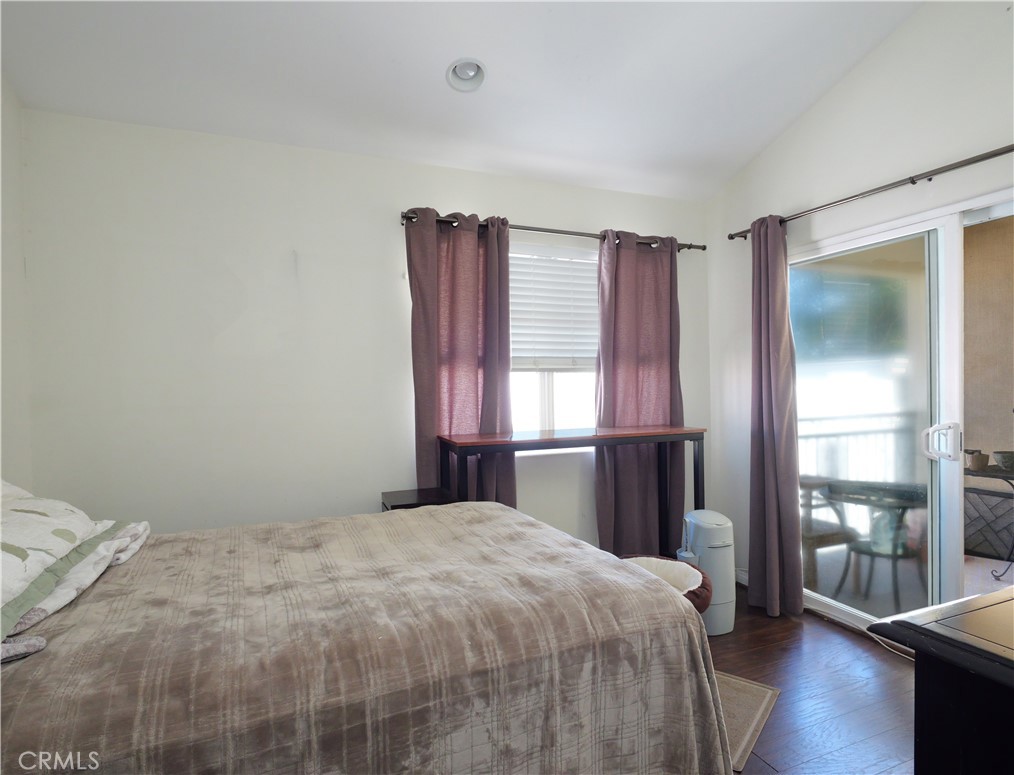 1323 Post Avenue, Unit K Torrance, CA 90501 - Photo 10 of 23 a bedroom with a large bed and a window