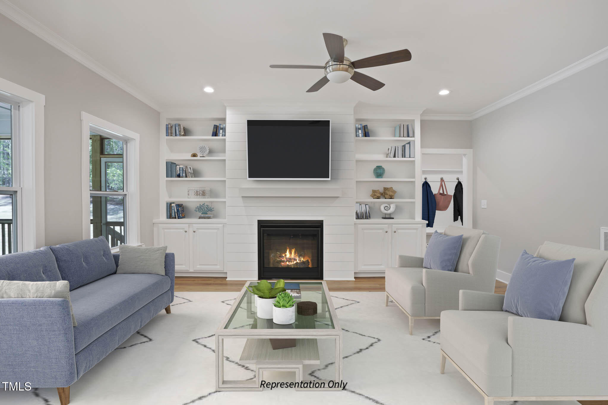 134 Merle Way Zebulon, NC 27597 - Photo 23 of 48 a living room with furniture a fireplace and a flat screen tv