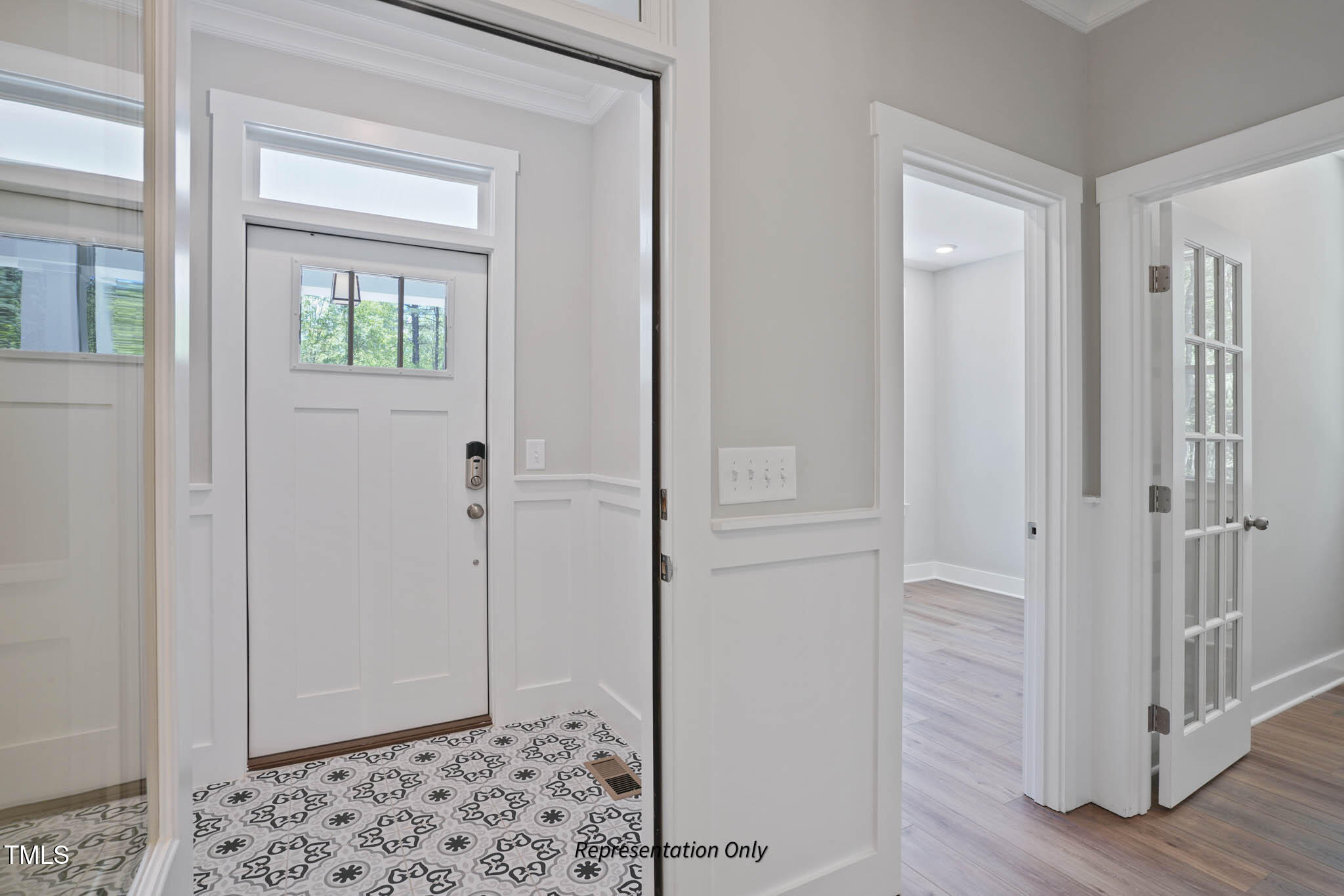 134 Merle Way Zebulon, NC 27597 - Photo 3 of 48 a view of a hallway with wooden floor