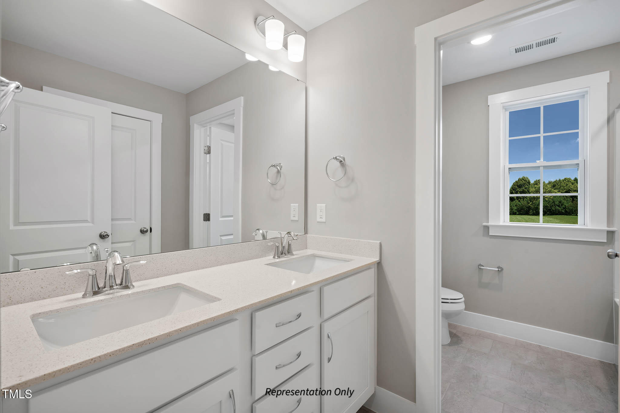 134 Merle Way Zebulon, NC 27597 - Photo 45 of 48 a bathroom with a sink double vanity and a mirror