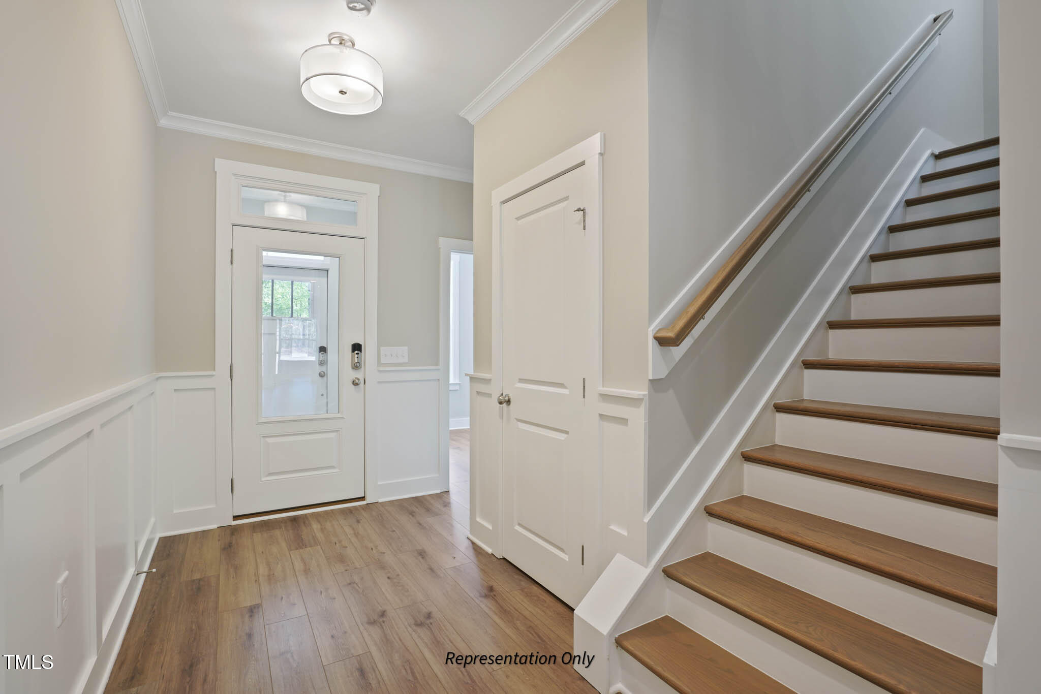 134 Merle Way Zebulon, NC 27597 - Photo 6 of 48 a view of a hallway with wooden floor and staircase