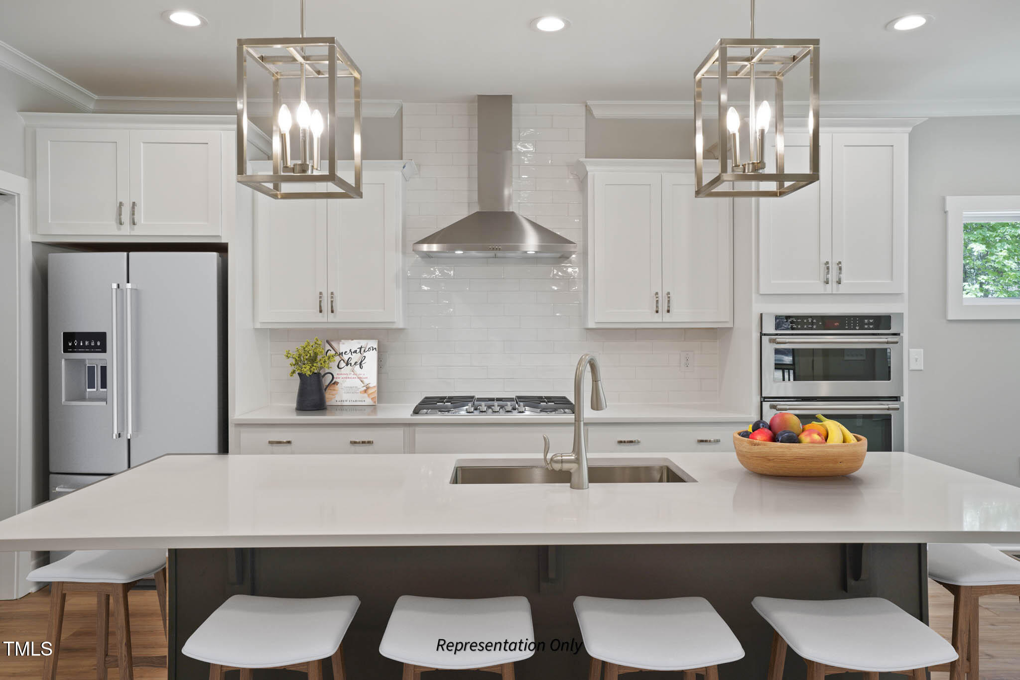 134 Merle Way Zebulon, NC 27597 - Photo 9 of 48 a kitchen with stainless steel appliances a table and chairs in it