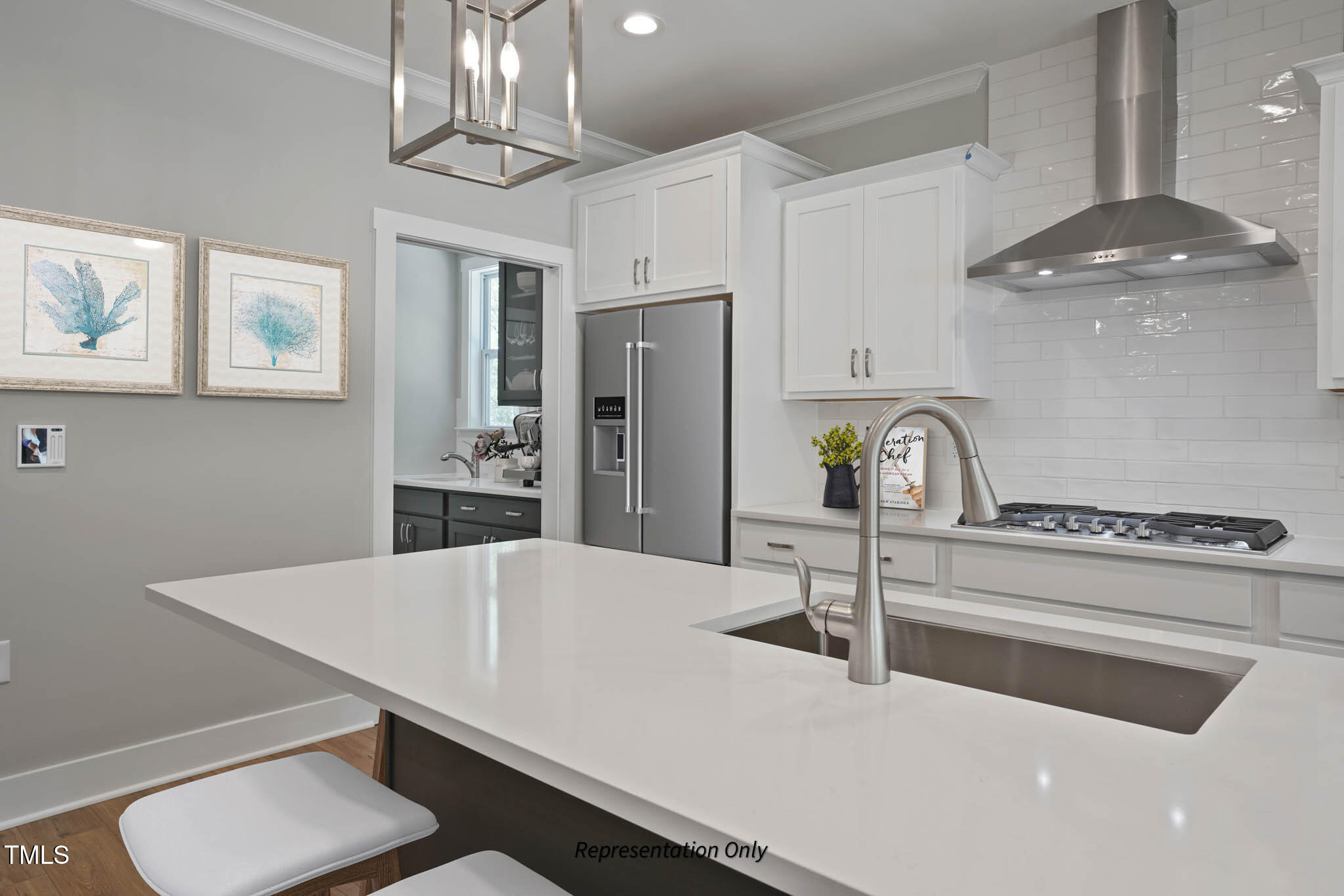 134 Merle Way Zebulon, NC 27597 - Photo 10 of 48 a kitchen with stainless steel appliances a table chairs and cabinets