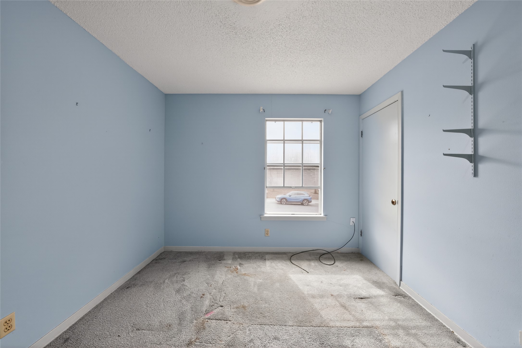 2112 Vanderbilt Lane Austin, TX 78723 - Photo 11 of 23 a view of an empty room with a window