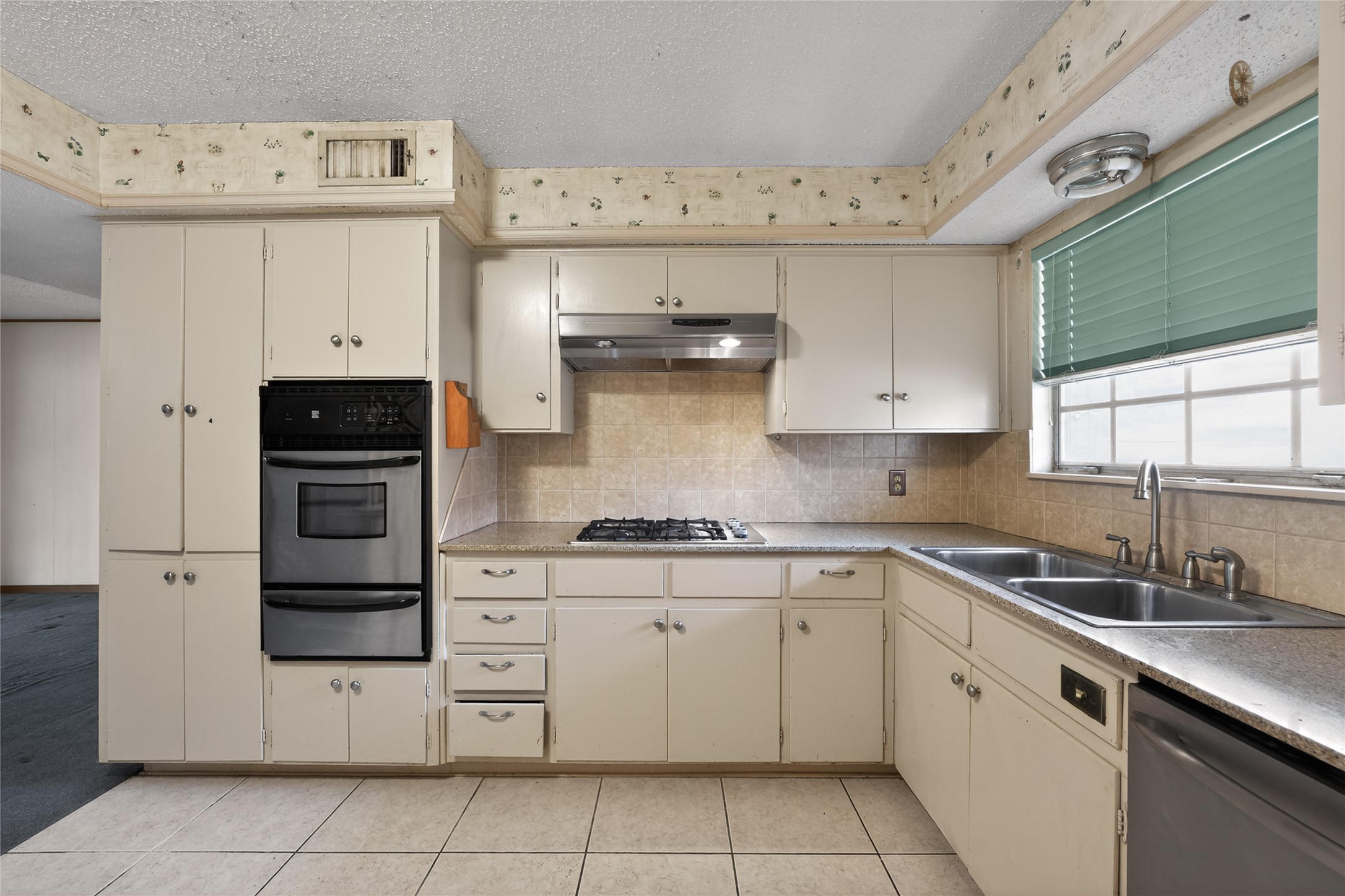 2112 Vanderbilt Lane Austin, TX 78723 - Photo 15 of 23 a kitchen with cabinets and stainless steel appliances