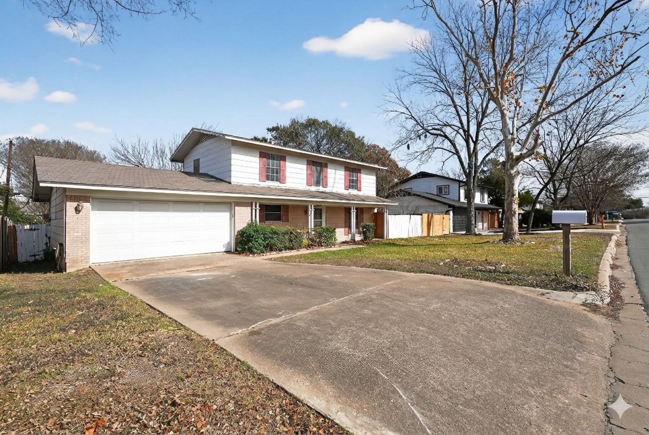 2112 Vanderbilt Lane Austin, TX 78723 - Photo 2 of 23 a front view of a house with a yard and garage