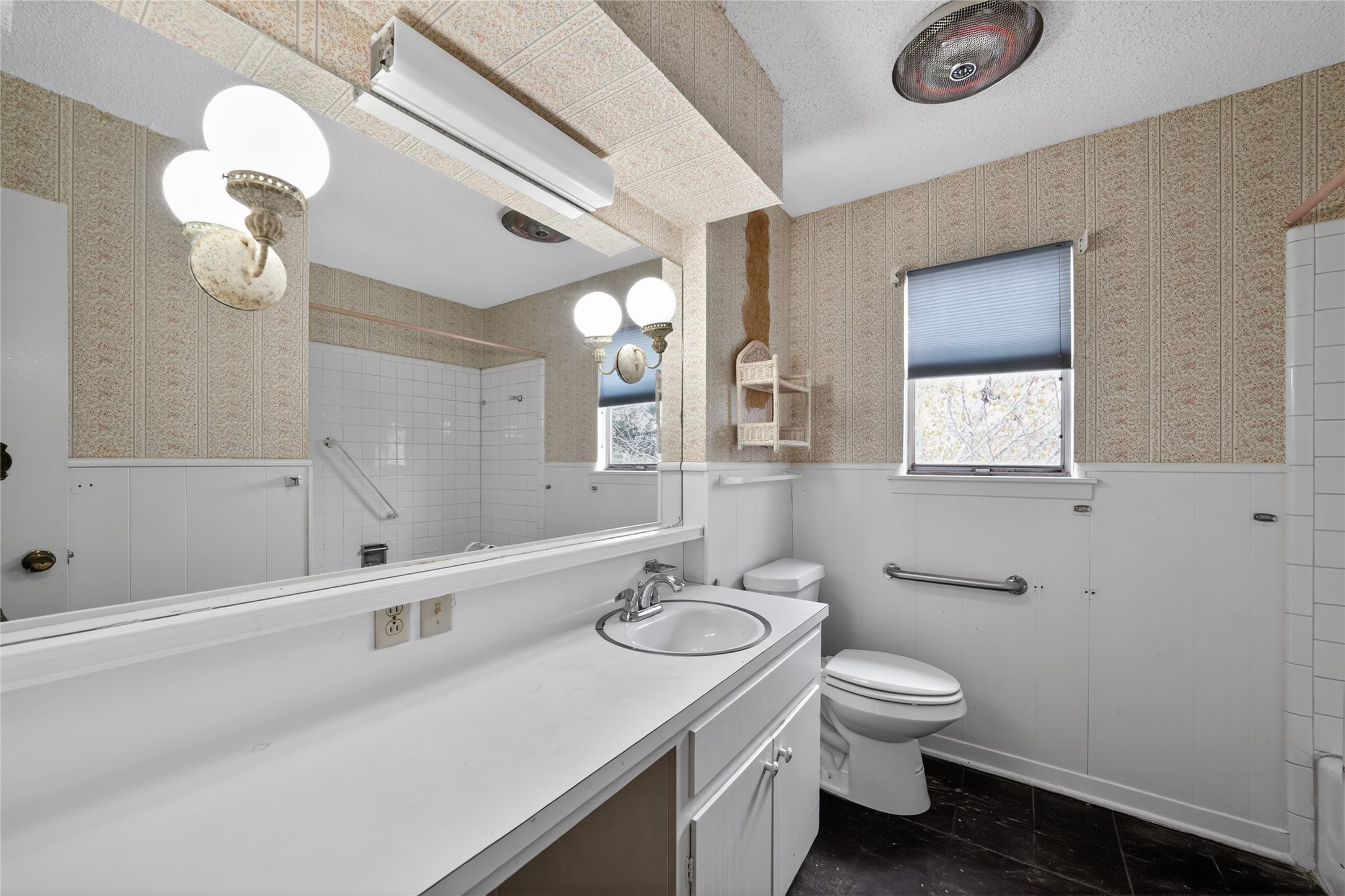2112 Vanderbilt Lane Austin, TX 78723 - Photo 22 of 23 a bathroom with a sink a toilet and shower