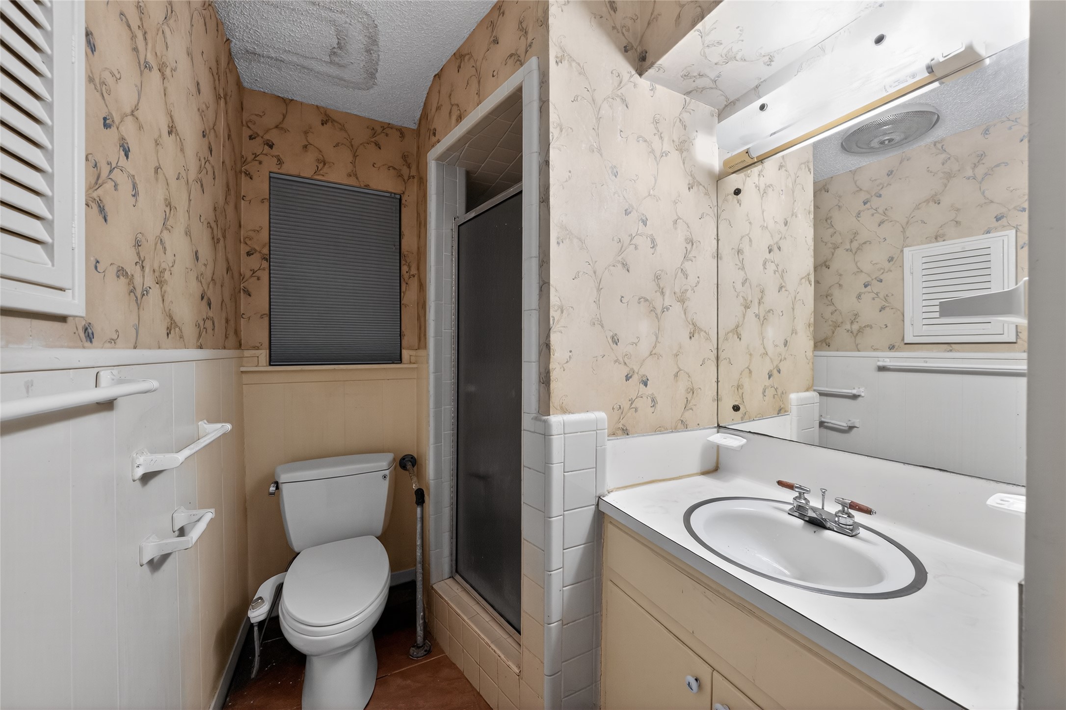 2112 Vanderbilt Lane Austin, TX 78723 - Photo 23 of 23 a bathroom with a sink toilet and shower