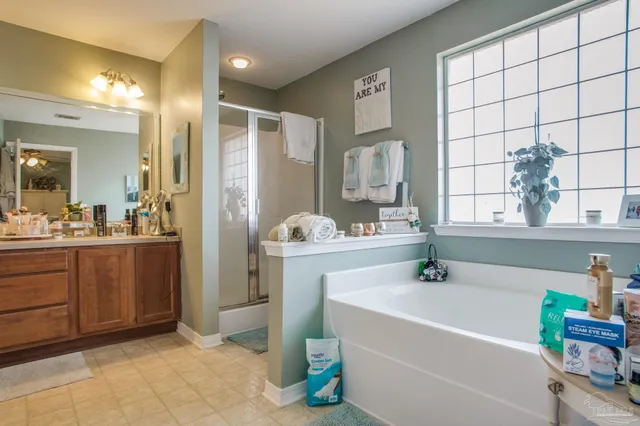 a bathroom with a glass shower door and mirror