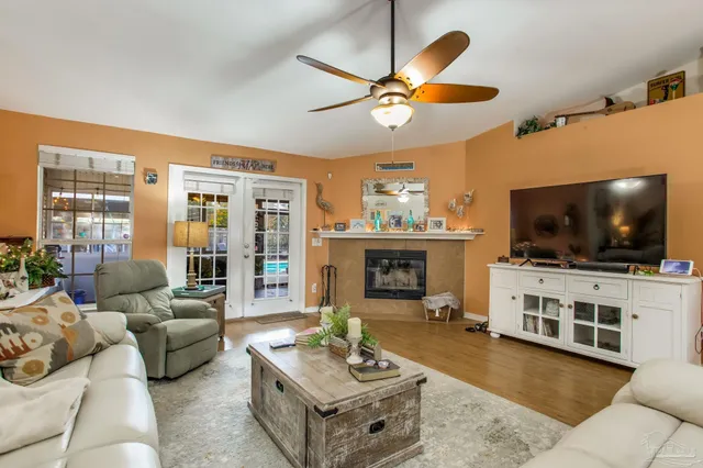 a living room with furniture and a flat screen tv