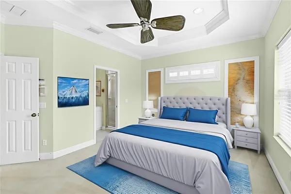 a bedroom with a bed and a chandelier