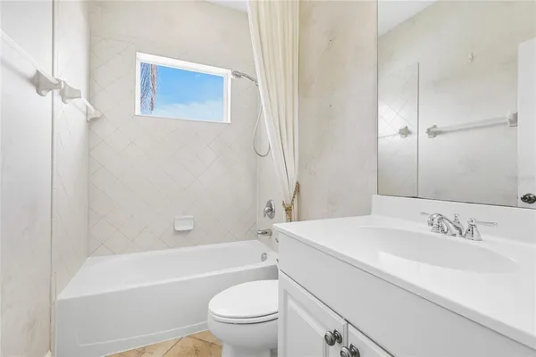 a bathroom with a sink a toilet and a bathtub