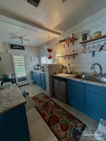 a kitchen with wooden cabinets and a stove