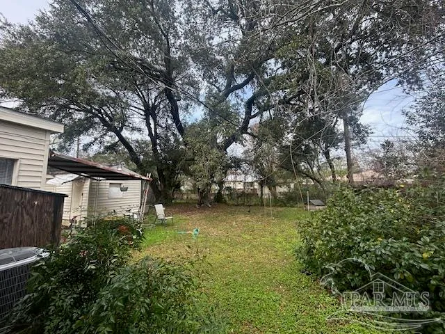 a backyard of a house with lots of green space