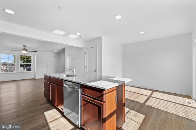 a kitchen that has a sink and a stove in it