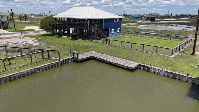 an outdoor space with swimming pool and green space