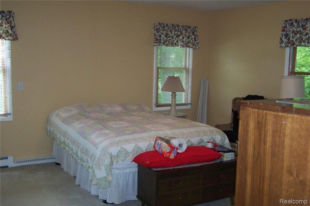 610 Young Road White Lake, MI 48383 - Photo 12 of 24 Master bedroom suite is spacious and has 2 closets and private bath