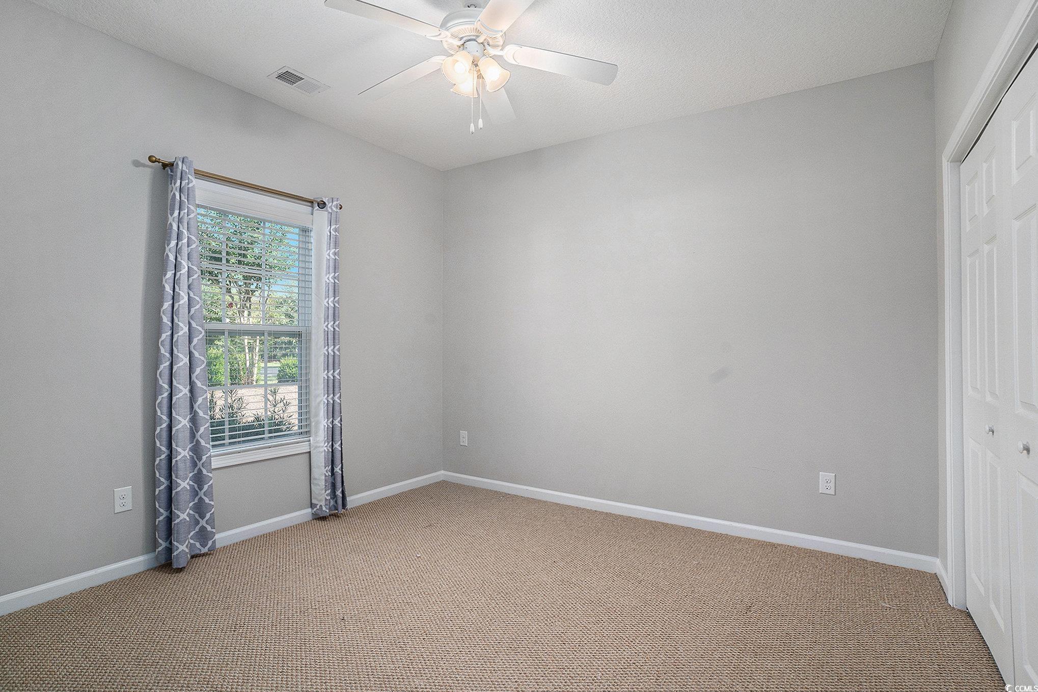 1018 Red Sky Lane, Unit 101 Murrells Inlet, SC 29576 - Photo 24 of 35 Walk in closet with carpet floors
