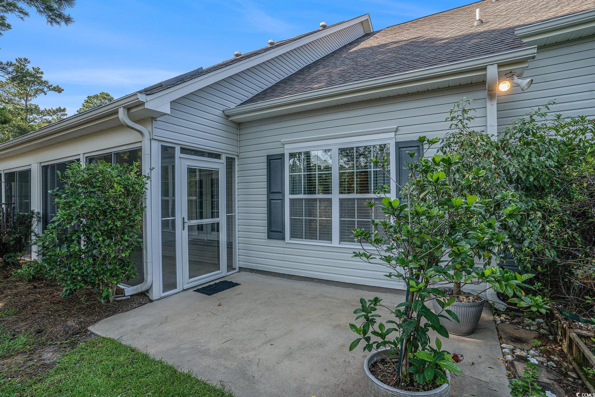 1018 Red Sky Lane, Unit 101 Murrells Inlet, SC 29576 - Photo 32 of 35 View of grassy yard featuring a patio