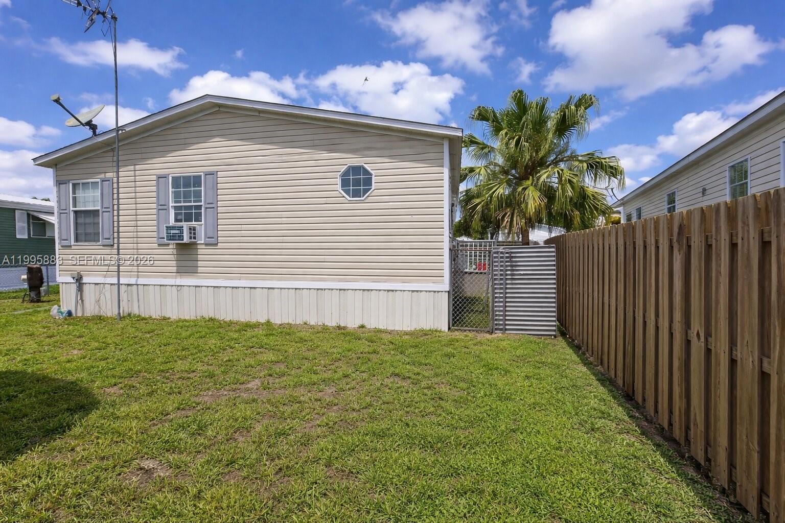 11846 Watergate Circle Boca Raton, FL 33428 - Photo 5 of 5 a front view of a house with a garden