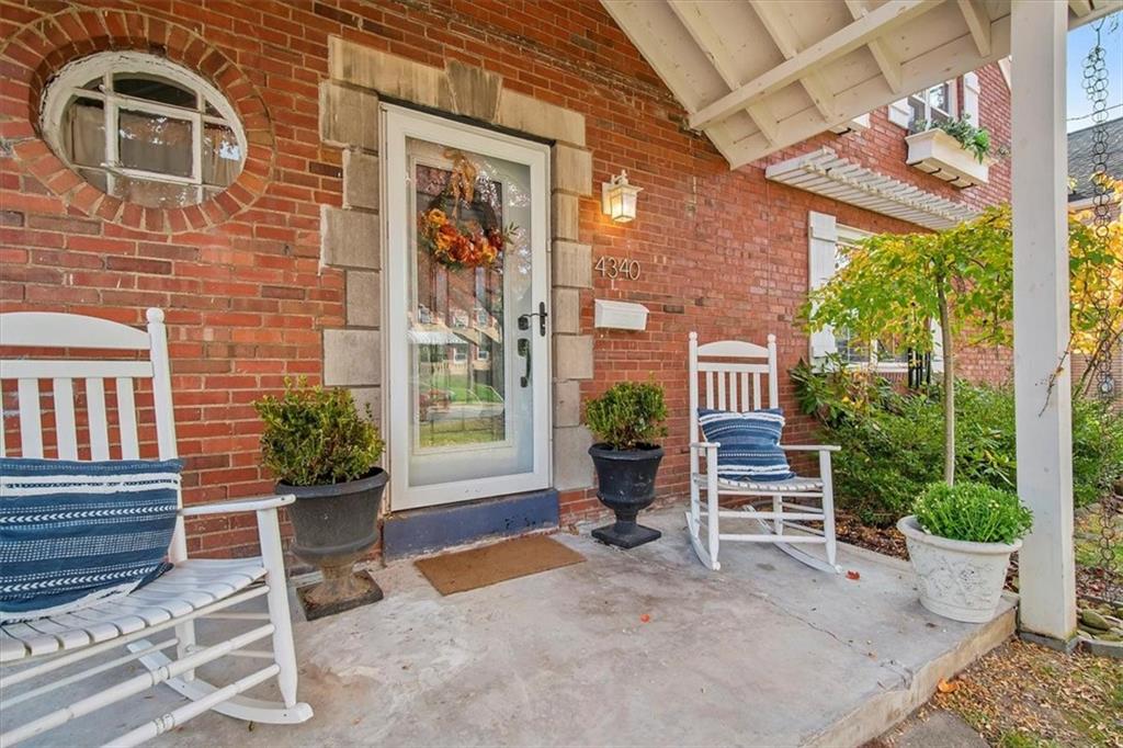 4340 Stanton Avenue Pittsburgh, PA 15201 - Photo 2 of 25 a brick building with a bench in front