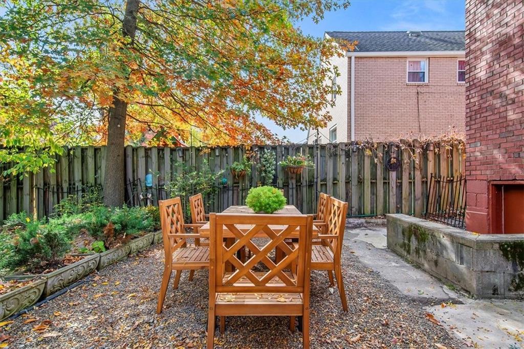4340 Stanton Avenue Pittsburgh, PA 15201 - Photo 23 of 25 a patio with glass top table and chairs