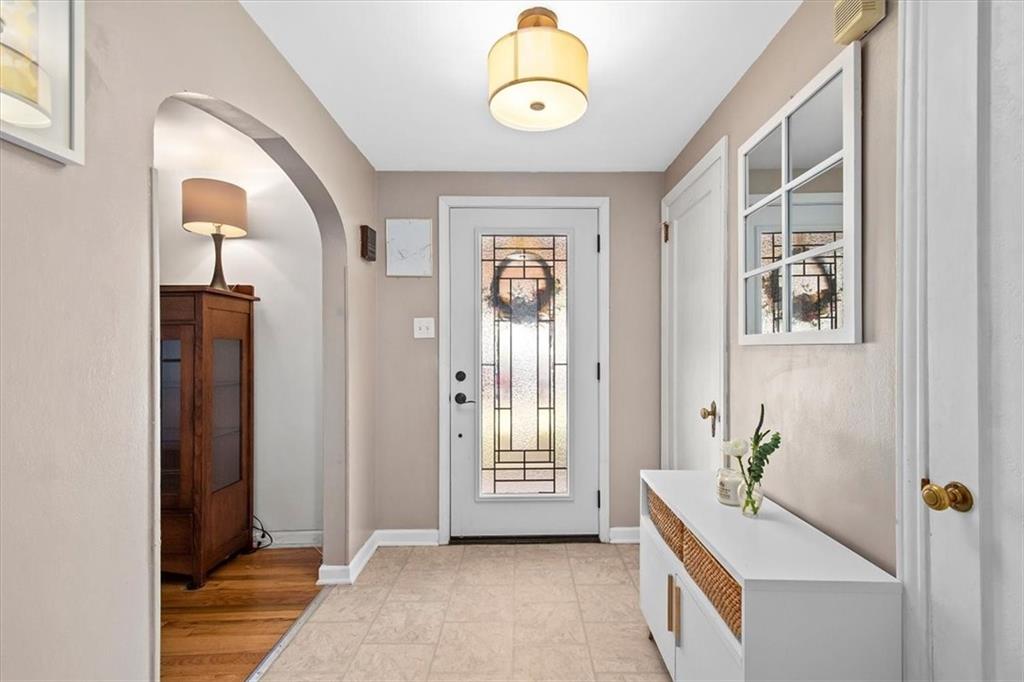 4340 Stanton Avenue Pittsburgh, PA 15201 - Photo 3 of 25 a view of a bedroom with wooden floor and windows
