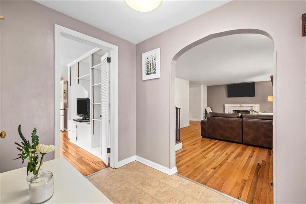 4340 Stanton Avenue Pittsburgh, PA 15201 - Photo 4 of 25 a living room with furniture and a flat screen tv