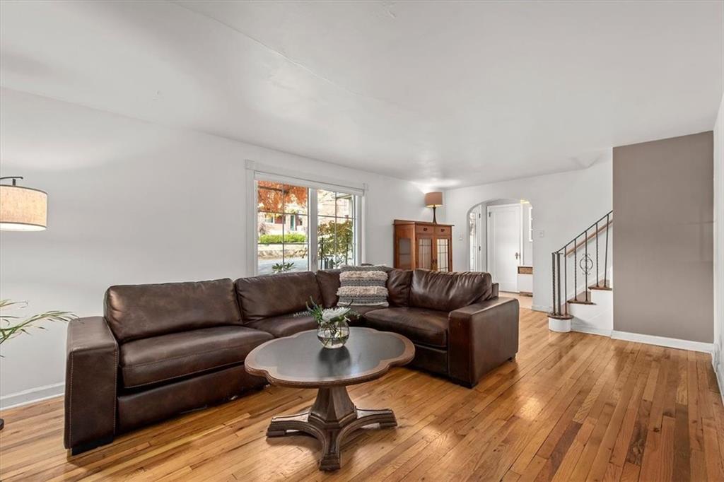 4340 Stanton Avenue Pittsburgh, PA 15201 - Photo 6 of 25 a living room with furniture and a wooden floor