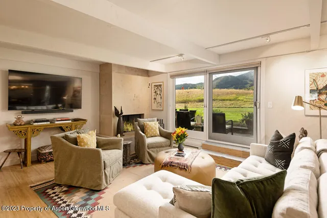 a living room with furniture and a table