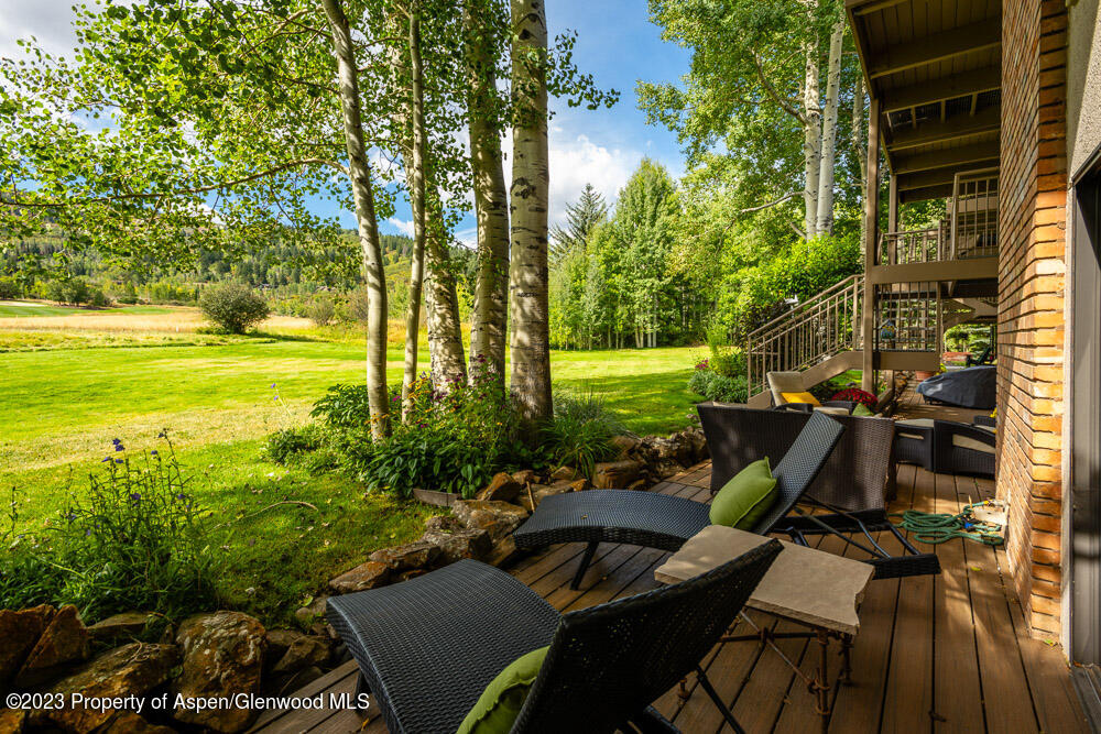39060 Highway 82, Unit 7 Aspen, CO 81611 - Photo 10 of 17 a view of a swimming pool and lounge chairs