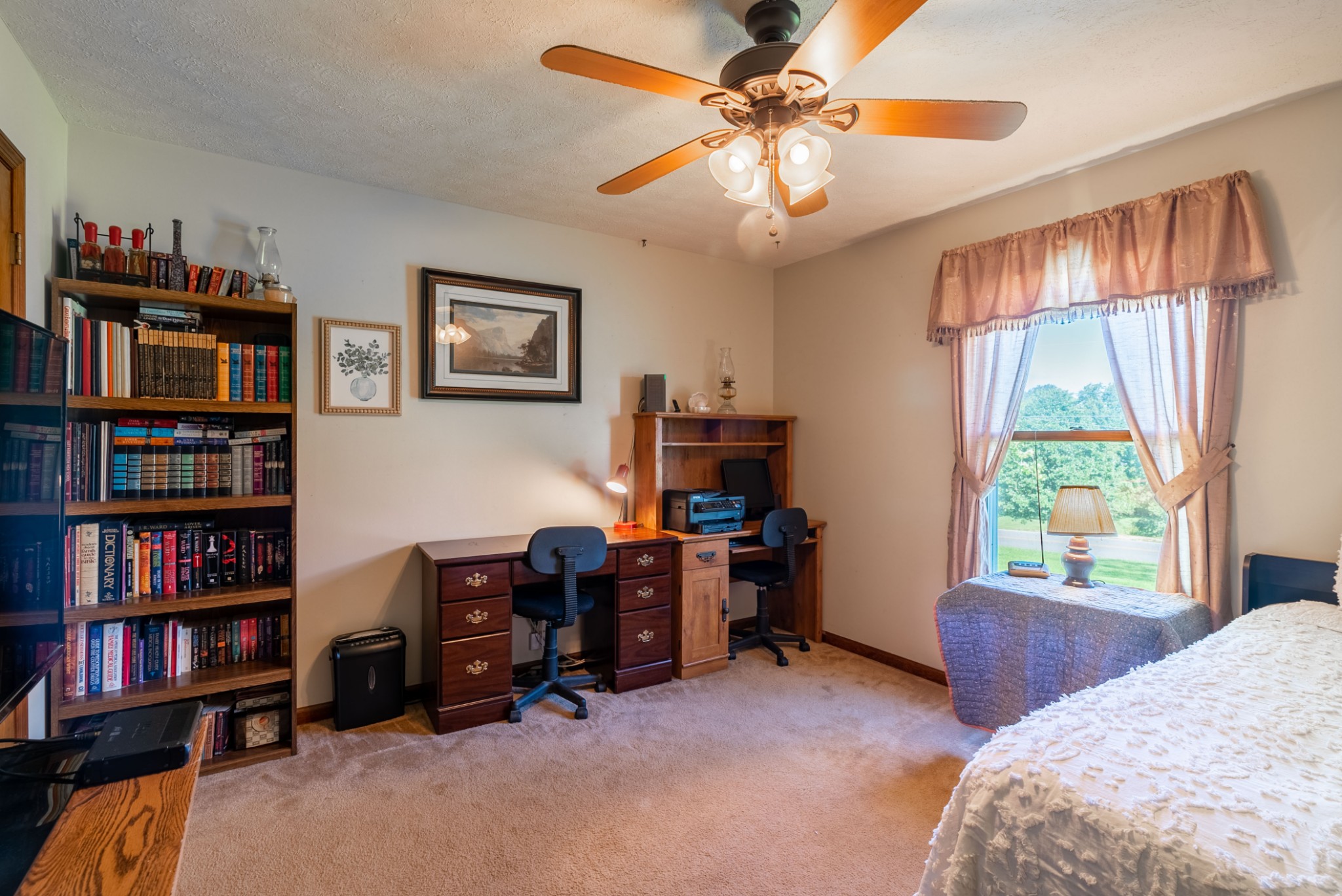 5743 Youngville Road Springfield, TN 37172 - Photo 30 of 39 a bedroom with a bed and a book shelf