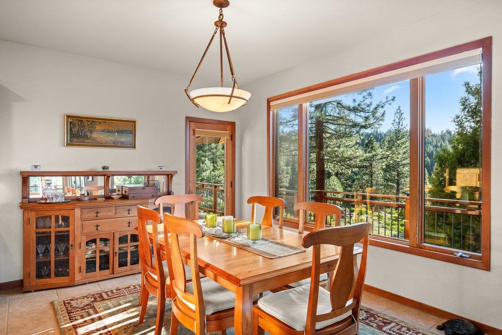 238 Clouds Rest Portola, CA 96122 - Photo 10 of 34 a view of a dining room with furniture window and outside view