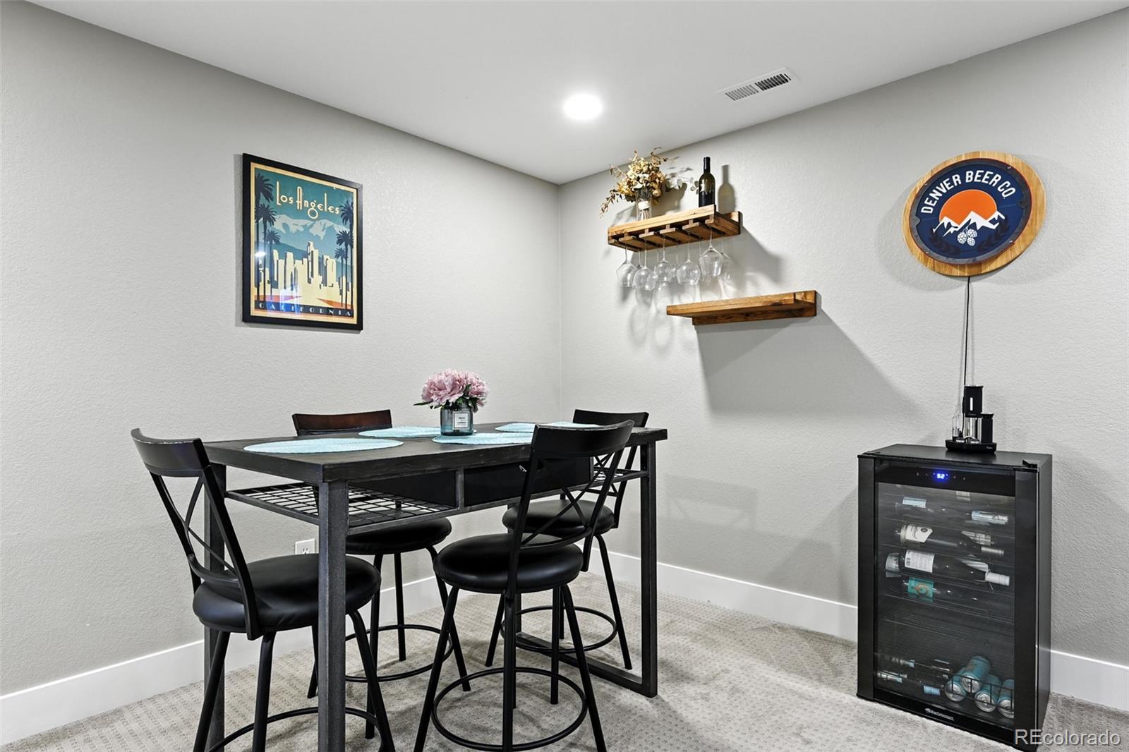 2714 South Raleigh Street Denver, CO 80236 - Photo 23 of 34 a view of a dining room with furniture and wooden floor