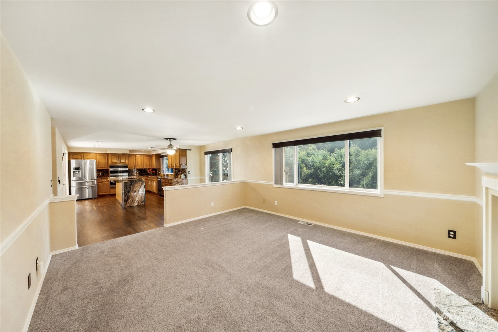 4609 Southwest 328th Place Federal Way, WA 98023 - Photo 12 of 32 a view of empty room with wooden floor and floor to ceiling window