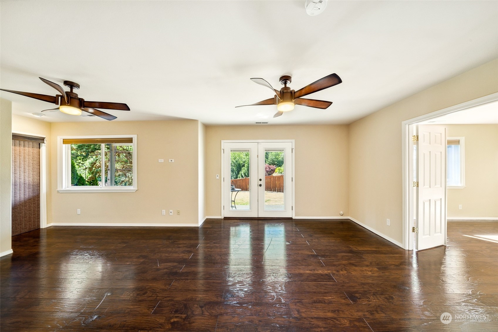4609 Southwest 328th Place Federal Way, WA 98023 - Photo 15 of 32 a view of an empty room with wooden floor and a window