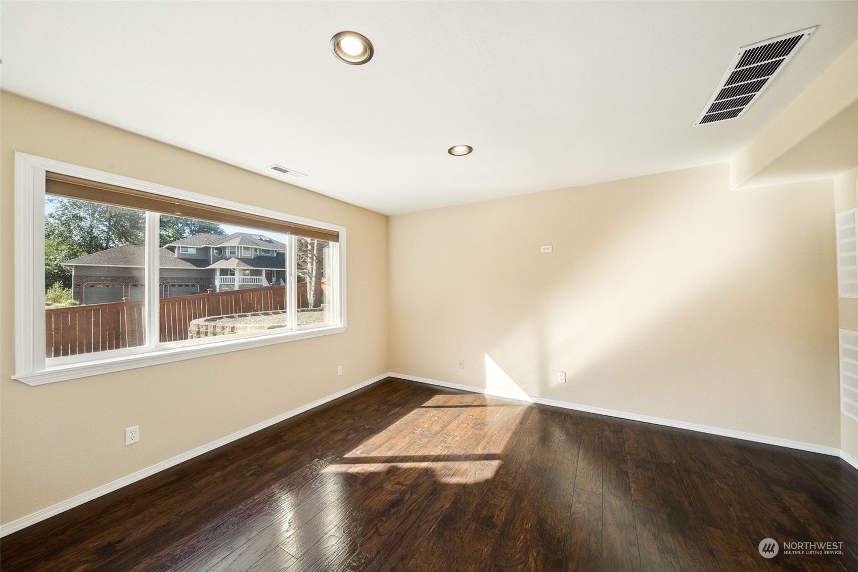 4609 Southwest 328th Place Federal Way, WA 98023 - Photo 17 of 32 an empty room with wooden floor and windows