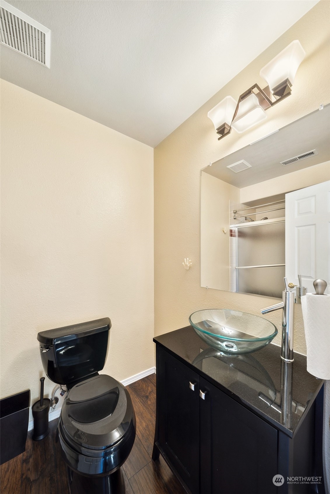 4609 Southwest 328th Place Federal Way, WA 98023 - Photo 18 of 32 a bathroom with a granite countertop sink a toilet and with a mirror
