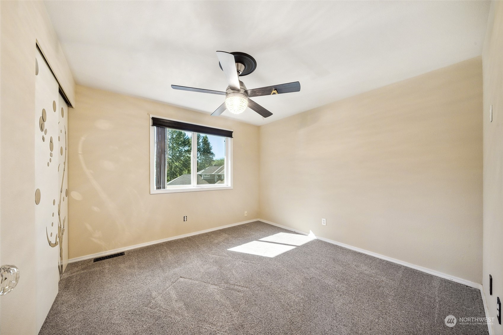 4609 Southwest 328th Place Federal Way, WA 98023 - Photo 21 of 32 an empty room with a window and a fan