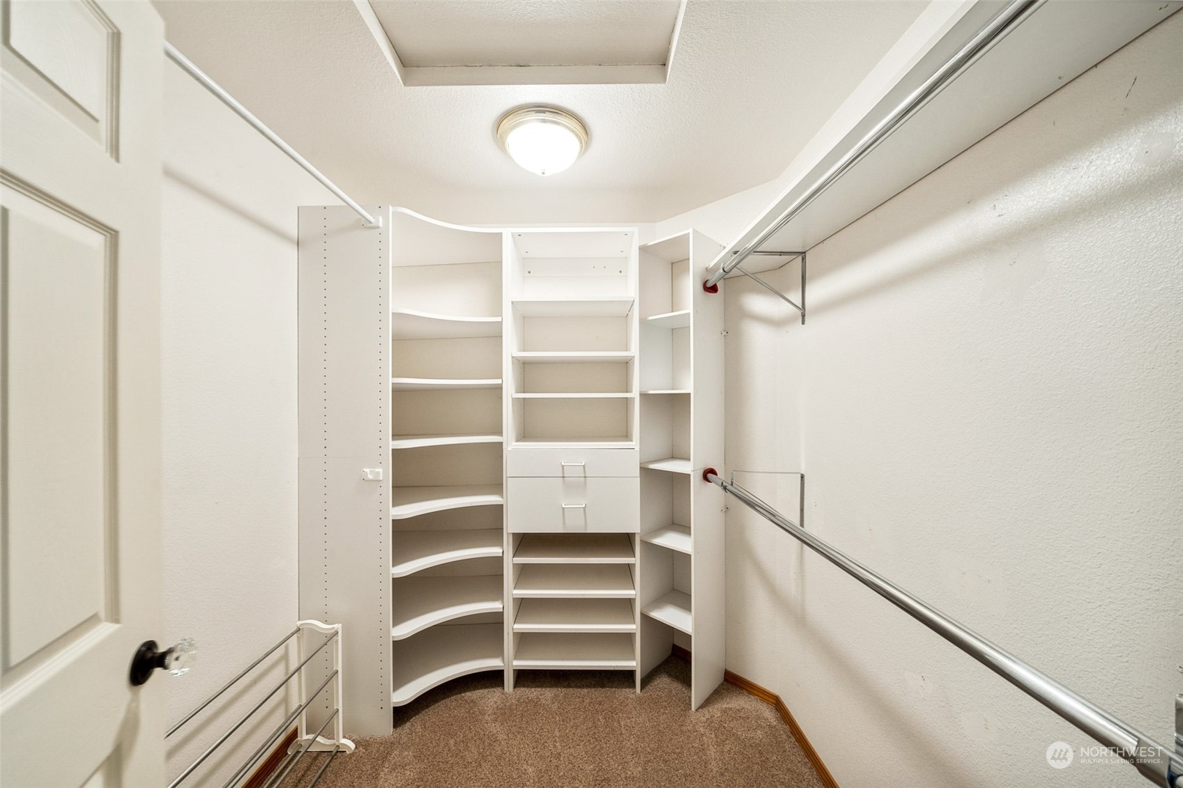 4609 Southwest 328th Place Federal Way, WA 98023 - Photo 27 of 32 a view of walk in closet with empty racks