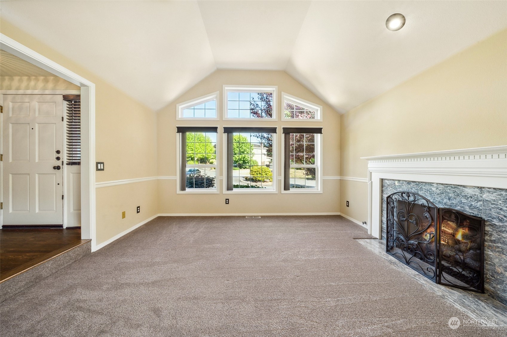 4609 Southwest 328th Place Federal Way, WA 98023 - Photo 5 of 32 an empty room with windows and fireplace