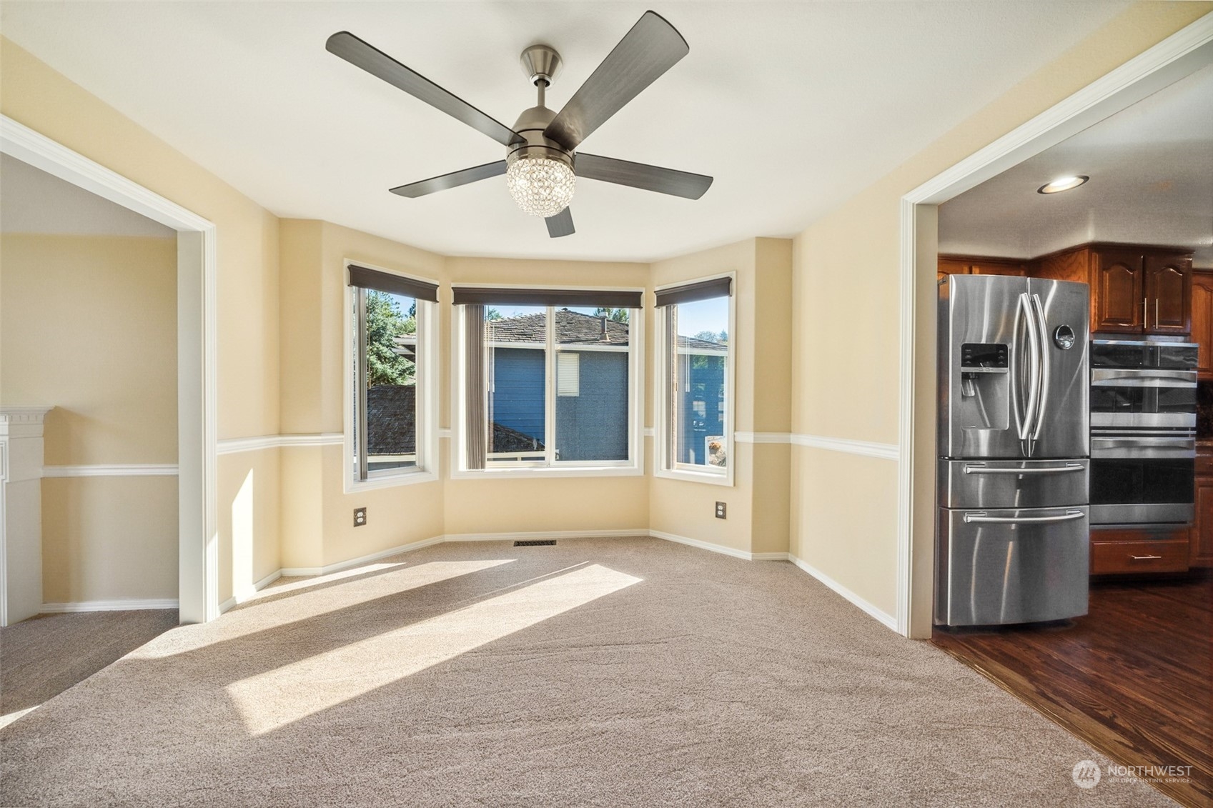 4609 Southwest 328th Place Federal Way, WA 98023 - Photo 6 of 32 a view of a big room with wooden floor and windows