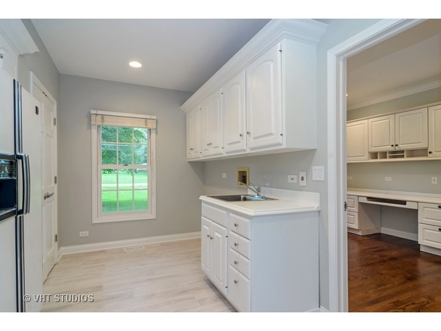820 North Inverway Road Inverness, IL 60067 - Photo 12 of 25 a kitchen with a sink cabinets and window