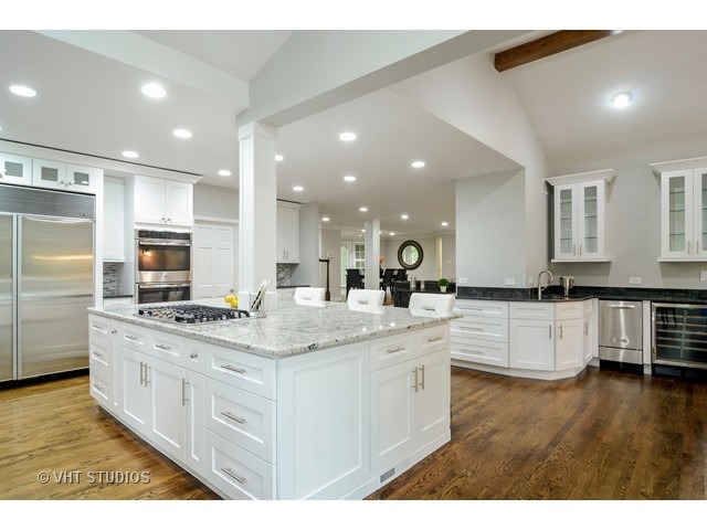 820 North Inverway Road Inverness, IL 60067 - Photo 5 of 25 a large white kitchen with a large counter top space a sink stainless steel appliances and cabinets