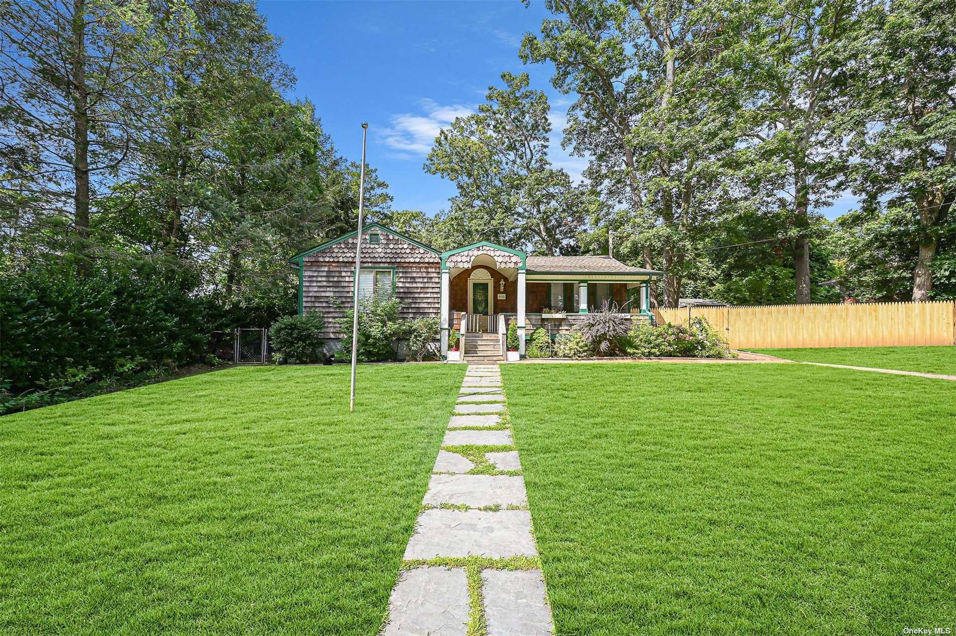 12 Lavender Road Rocky Point, NY 11778 - Photo 1 of 1 a front view of a house with a yard