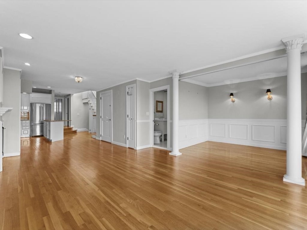 458 Beacon Street, Unit 6 Boston, MA 02115 - Photo 12 of 16 a view of empty room with wooden floor